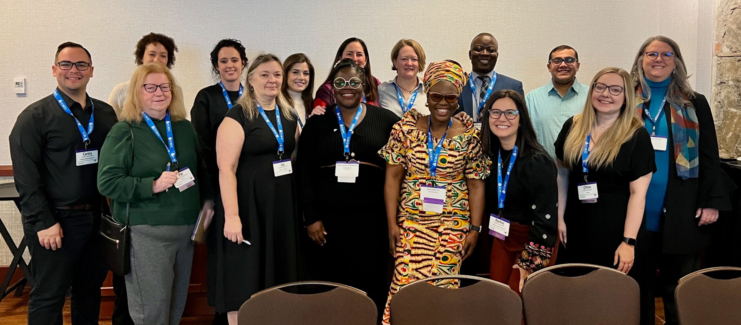 Fifteen members of the Mixed Methods SIG standing in a room.
